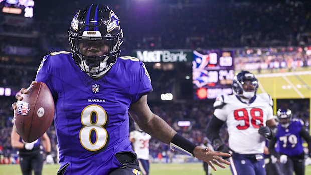 Jan 20, 2024; Baltimore, MD, USA; Baltimore Ravens quarterback Lamar Jackson (8) reacts after running past for Houston Texans defensive tackle Sheldon Rankins (98) for a touchdown during the fourth quarter in a 2024 AFC divisional round game at M&T Bank Stadium. Mandatory Credit: Tommy Gilligan-USA TODAY Sports